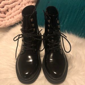 Shiny black combat boots